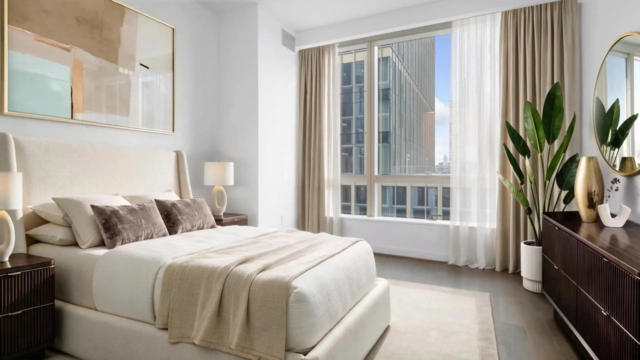 Staged bedroom with a city view