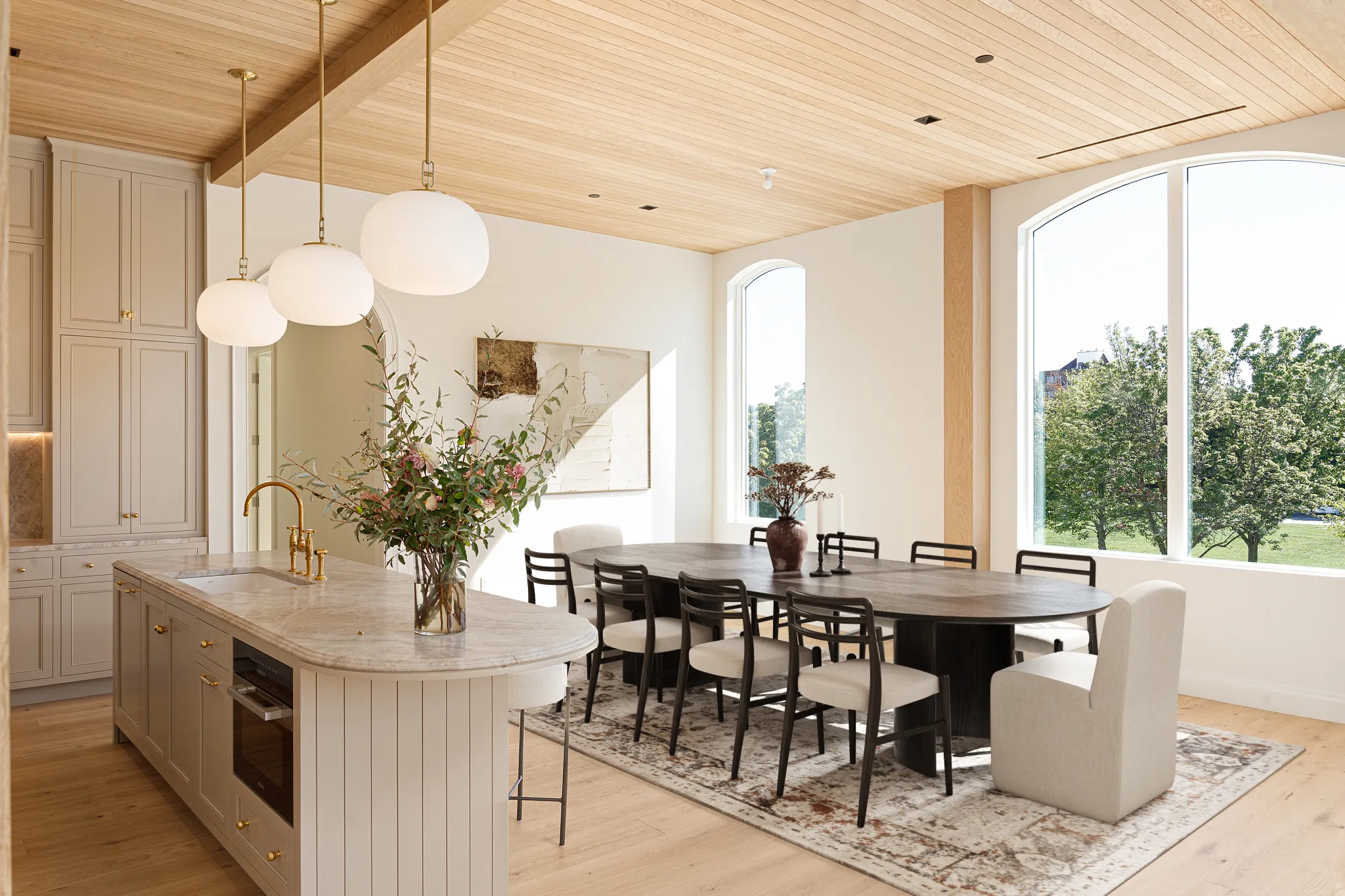 Kitchen and dining room with oak ceiling and beige cabinetry