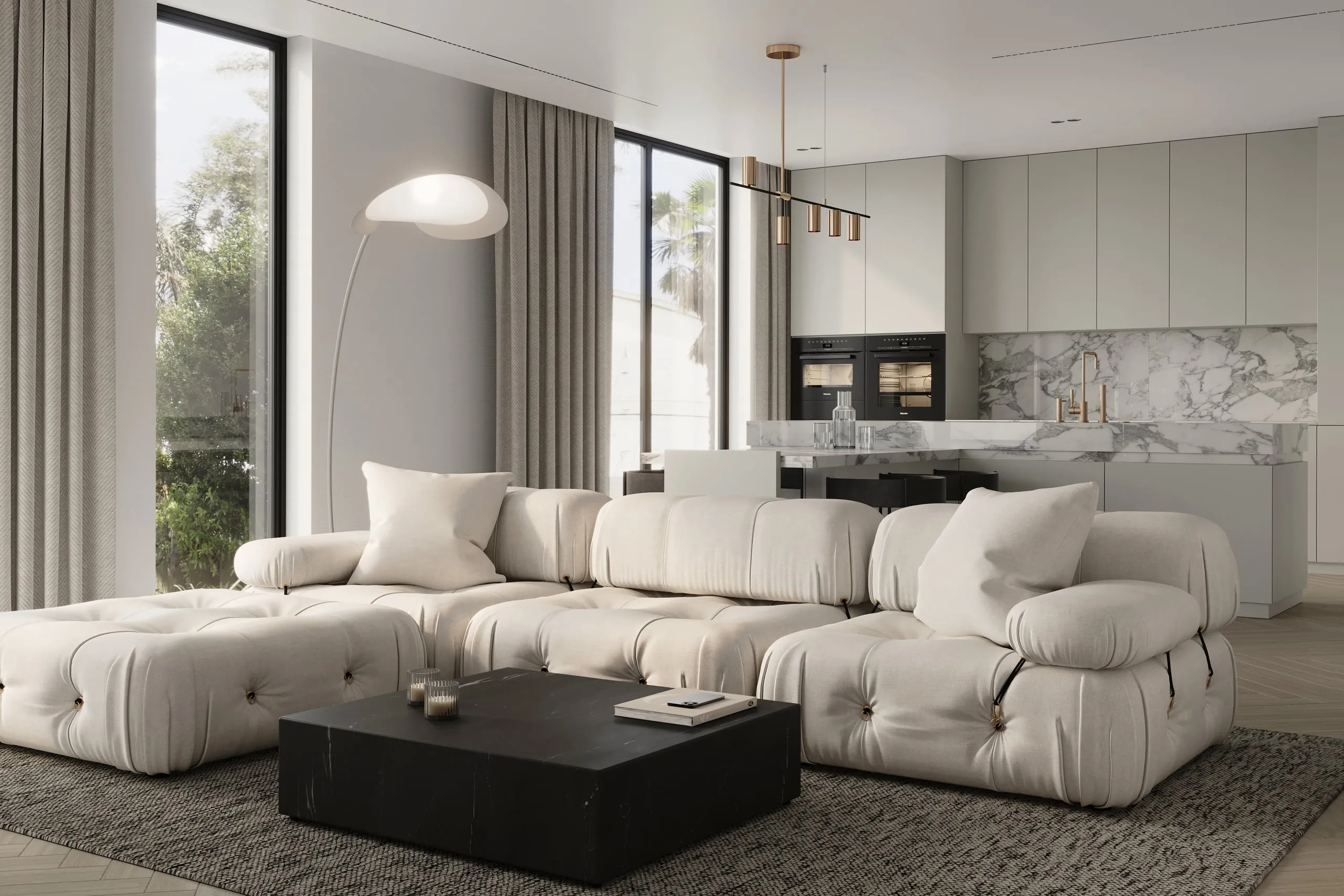 Living room opening into a marble kitchen