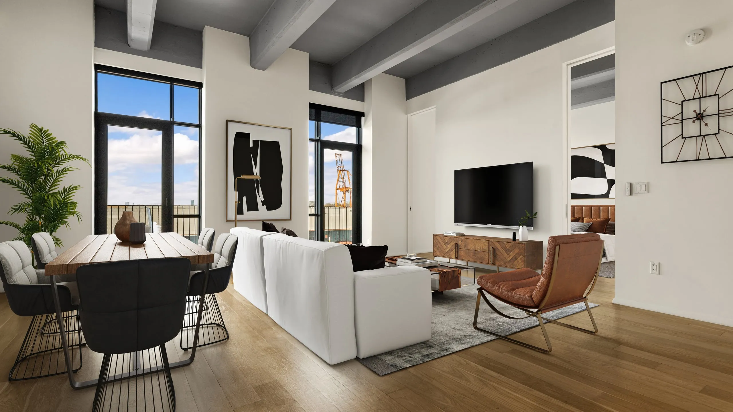 Loft living and dining room with a white sofa